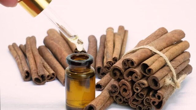 cinnamon essential oil in small bottles. selective focus.