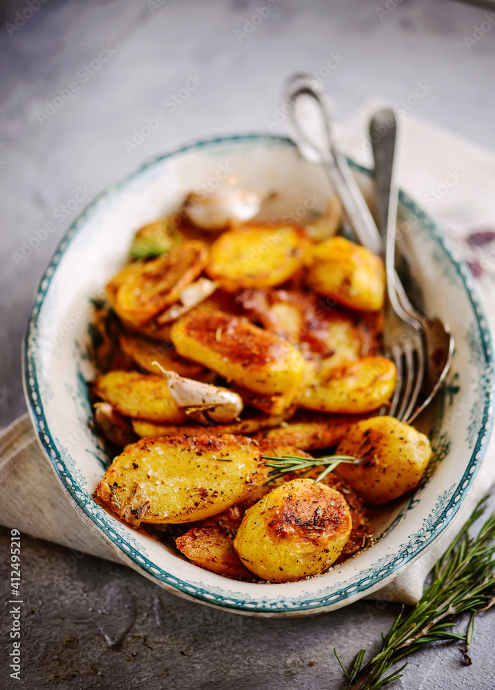 Wall mural Roasted potatoes.style rustic.selective focus