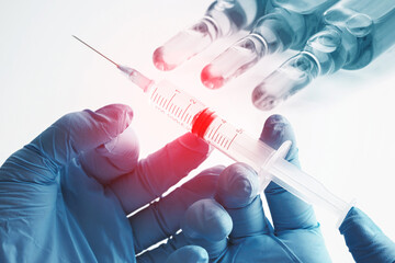 Doctor's hands holding syringe with a vaccine, medical remedy or cosmetics
