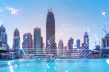 Skyscrapers of Dubai business downtown. International hub of trading and financial services. Technology theme icons hologram, Fintech concept. Double exposure. Dubai Canal waterfront.