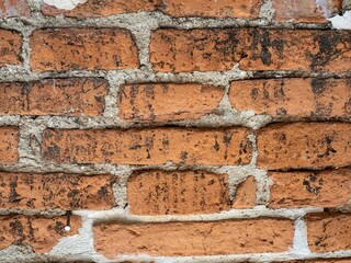 Texture of a orange stone wall. Old archaeological site wall texture background. Stone wall as a background or texture.