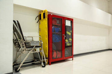 Wall Hanging Fire Extinguisher, Fire Safety, stretchers  and Emergency Equipment install in Red Box wall mount architectural fire extinguisher glass cabinet in Industrial building.