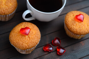 love cupcakes, coffee and love hearts on wooden background.