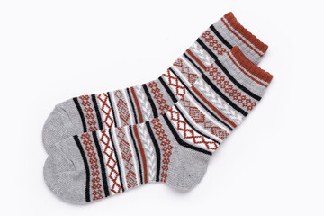 Multicolored socks with ornaments for sports and leisure in cold weather. Isolated on white.