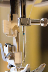 macro of a sewing machine's needle
