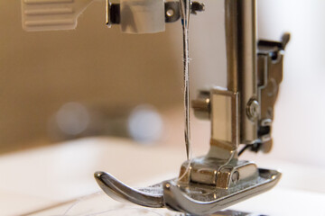 macro of a sewing machine's needle