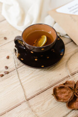 Lifestyle, cozy mug of lemon and spice tea. Soft blurred focus. Perfect background.
