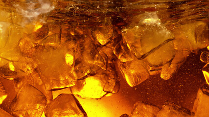Detail of cola or alcoholic drink with ice cubes