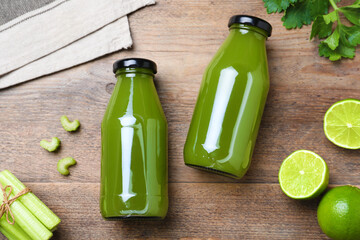 Bottles with celery juice and fresh ingredients on wooden table, flat lay