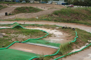 muddy wet race track for radio control model car with nitro engine. wet pc race.