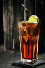 Classic Cuba Libre cocktail with brown rum, cola and lime, long drink at the Cubalibre bar