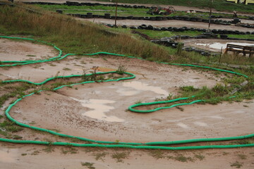 muddy wet race track for radio control model car with nitro engine. wet pc race.