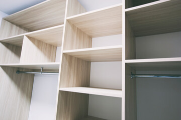 The empty shelves in the wardrobe