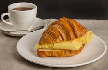 Breakfast with croissant selective focus