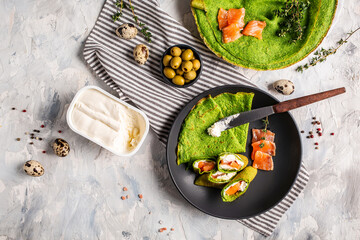 spinach crepes or pancakes with smoked salmon and cream cheese. Delicious breakfast or snack on a...