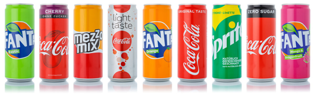 Coca Cola Coca-Cola Fanta Sprite products lemonade soft drinks in cans in a row isolated on a white background