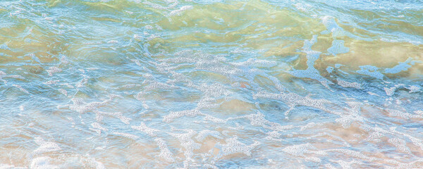 crystal clear azure water with sea foam, seascape background