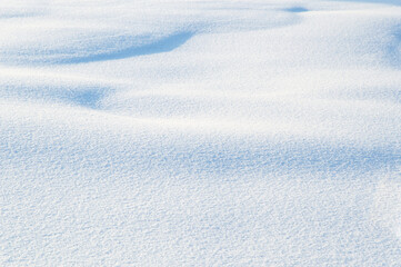 winter landscape: loose shiny snow, drifts and snow dunes