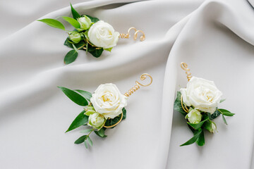 Wedding Boutonniere on a white tablecloth