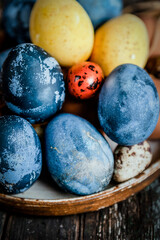 assortment of Easter dyed eggs on shabby vintage background, festive gift card