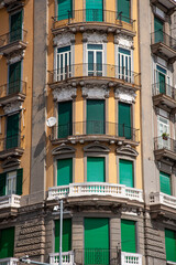 Fototapeta na wymiar Green shutters on a typical Naples street corner