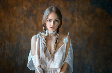 Girl in white with pigtails