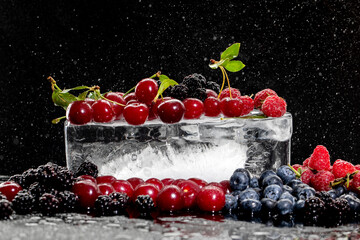 Summer berries, raspberry, blueberry, cherry, blackberry on ice 