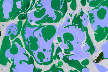 Colorful marble ink texture on watercolor paper background. Marble stone image. Bath bomb effect. Psychedelic biomorphic art.