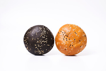 Burger bread buns on white background, black burger bread bun and white burger bread with sesame seeds
