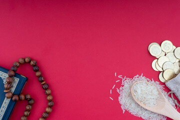 Holy Quran, Coins,Rosary and rice. Zakat concept. Zakat is a form of alm-giving as a religious obligation