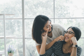 Young asian women lesbian lgbt couple with happy moment. LGBT lesbian couple together indoors concept.