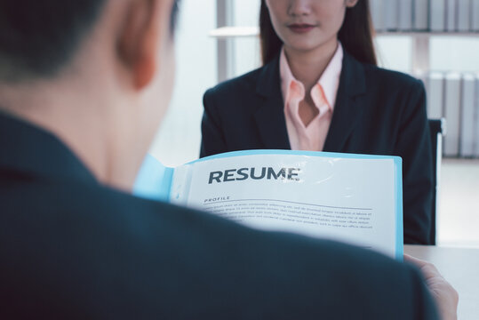 Recruiter interview young asian woman job candidate asking questions for a job interview.