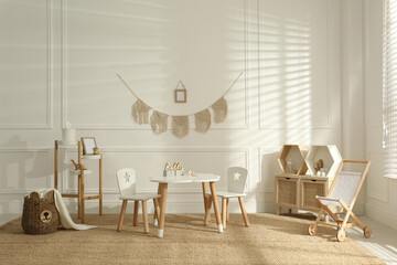 Modern child room interior with stylish furniture and accessories