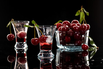 Fresh cocktail with syrup, cherry and orange