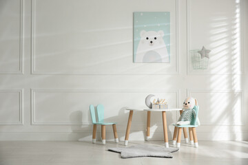 Baby room interior with stylish furniture and toys