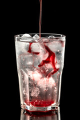 Summer fresh cocktail with soda and cherry syrup 