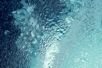 Ice texture on the window in trendy green color