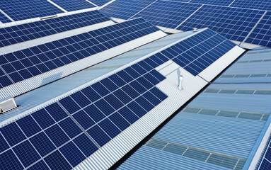 Solar panels on a roof of a company Solar panels are a cheap and sustainable way to obtain energy...