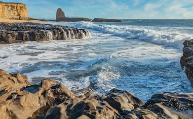 The beautiful landscape of the Pacific coast, rocks, ocean, waves, Santa Cruz and Davenport have some of the most beautiful beaches in California.