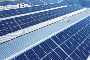 Solar panels on a roof of a company Solar panels are a cheap and sustainable way to obtain energy...
