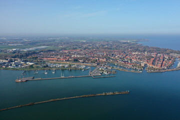 Fototapeta premium Aerial drone photo of the beautiful historic city of Enkhuizen, with old town marina harbors in the Netherlands