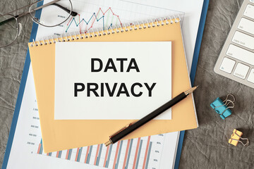 DATA PRIVACY is written in a document on the office desk