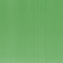 Green ink and watercolor texture on white paper background. Gradient paint strokes and decalcomania effect. Hand-painted gouache abstract image. Mess on the canvas.