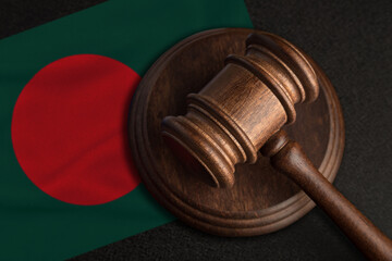 Judge gavel and flag of Bangladesh. Law and justice in Bangladesh. Violation of rights and freedoms