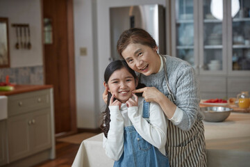 grandmother and granddaughter cooking time