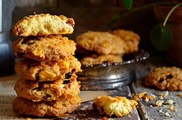 Coconut cookies stacked on a wooden background