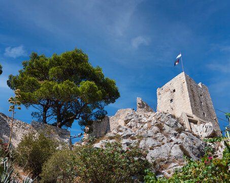 Historic view at famous romanesque landmark fortress Mirabela above town Omis, Dalmatia region, Croatia.
