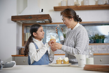 grandmother and granddaughter cooking time