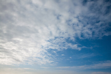 Naklejka na ściany i meble White clouds and blue sky. Background image