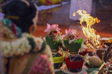 Selective focus shot of a female doing the Yajna/Yagya Hinduism ritual